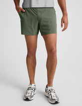 green men's 5" shorts on a plain background.